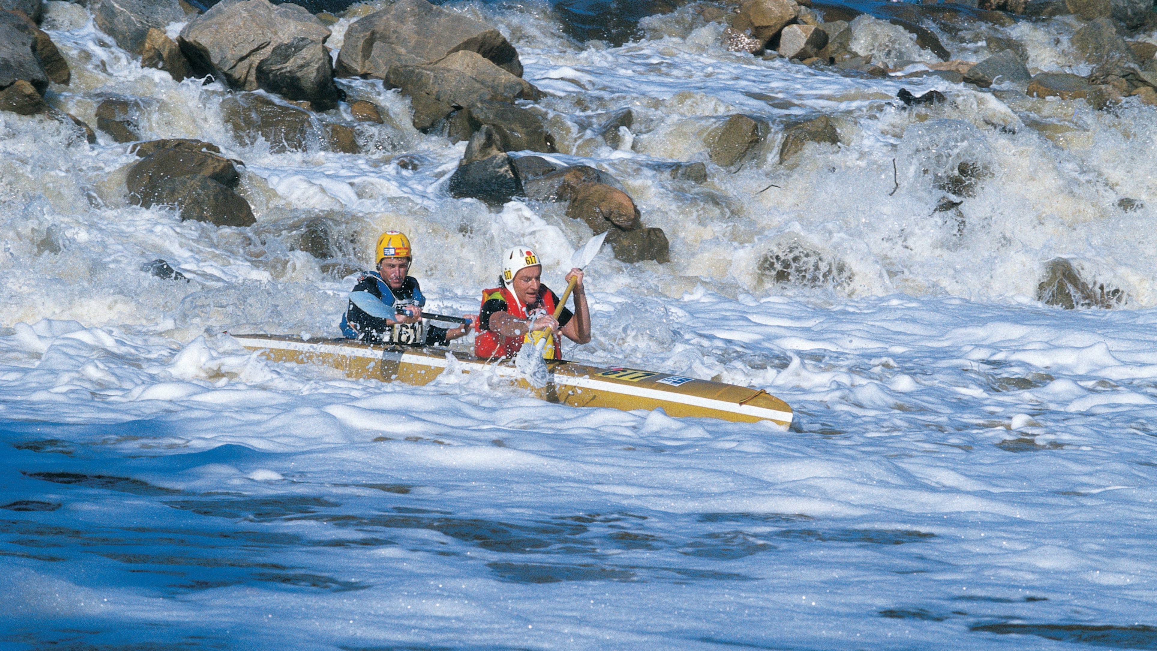 Men white water rafting in the avon river